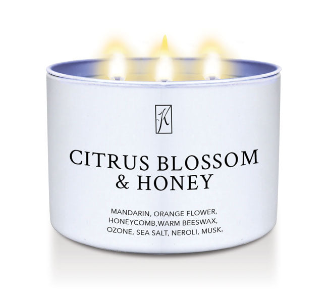 Citrus Blossom & Honey scented candle in a white tin container.