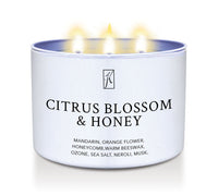 Citrus Blossom & Honey scented candle in a white tin container.