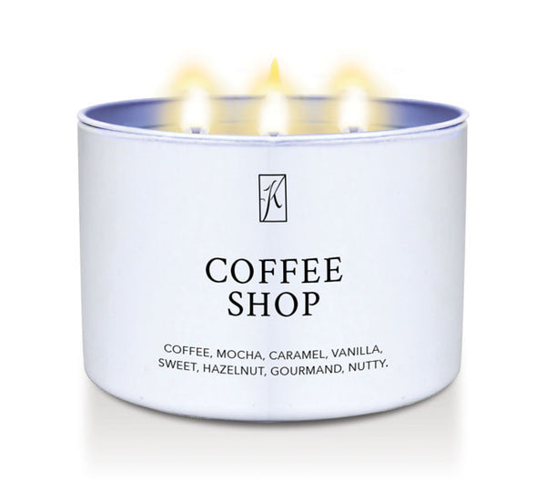 Candle in a white container labeled 'Coffee Shop' with flames on a white background