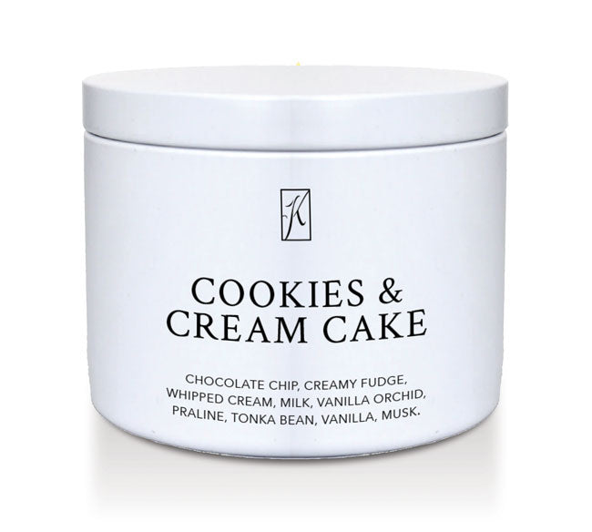  'Cookies & Cream Cake' candle in a tin container on a white background.