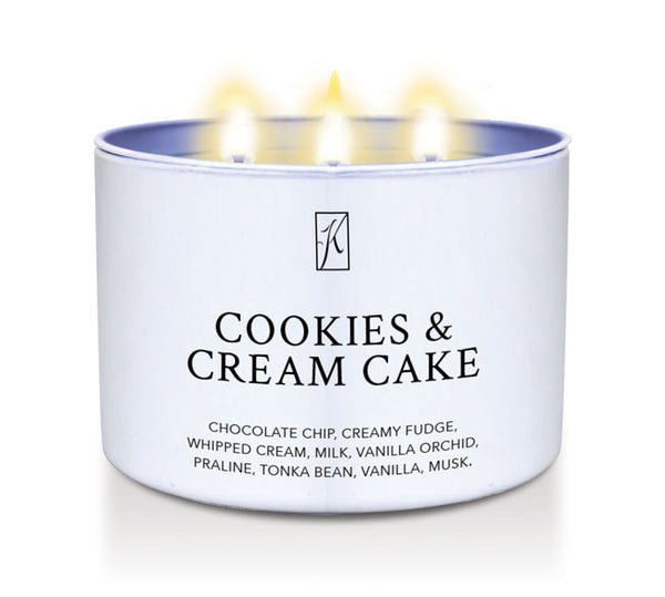 Candle in a white tin container labeled 'Cookies & Cream Cake' with flames on a white background by Kringle Candle.