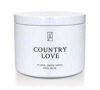 White tin container with 'Country Love' fragrance description on a white background