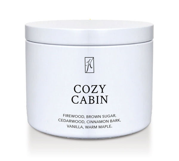 White container of 'Cozy Cabin' candle with a logo on a white background
