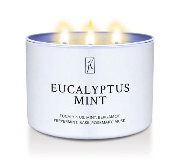 Candle in a white container labeled 'Eucalyptus Mint' with a logo on a white background