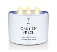 Candle in a white tin container labeled 'Garden Fresh' with a Kringle Candle logo on a white background