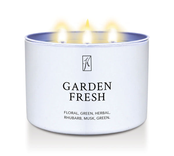 Candle in a white tin container labeled 'Garden Fresh' with a Kringle Candle logo on a white background