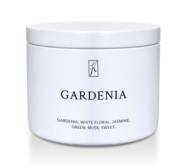 White tin candle container labeled 'Gardenia' with a brand logo on a white background
