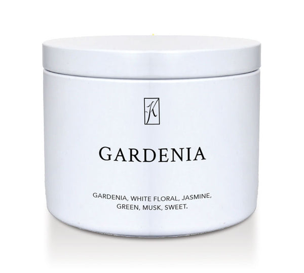 White tin candle container labeled 'Gardenia' with a brand logo on a white background