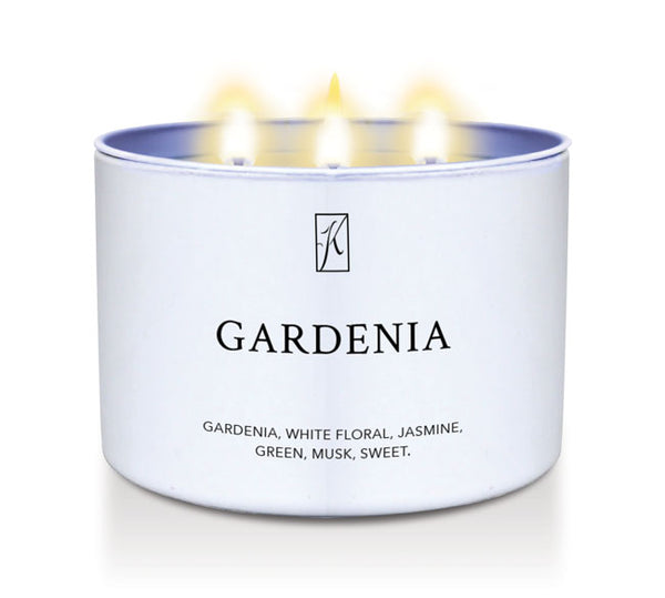 Candle in a white tin container labeled 'Gardenia' on a white background by Kringle Candle