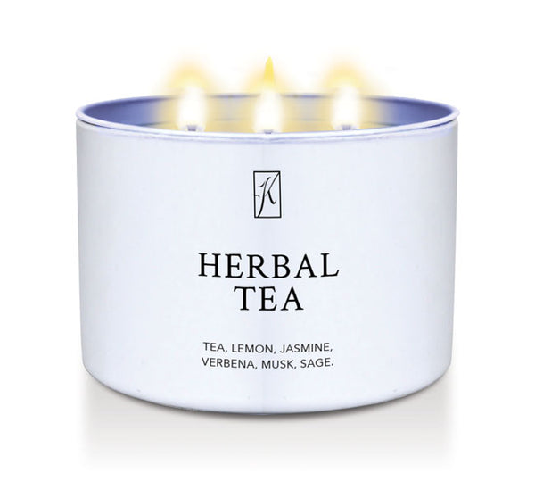 Candle in a white container labeled 'Herbal Tea' with a logo on a white background