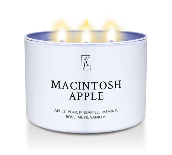 Candle in a white container labeled 'Macintosh Apple' with a logo on a white background