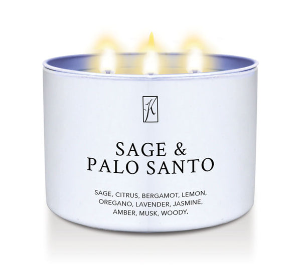 Candle in a white container labeled 'Sage & Palo Santo' with flames on a white background