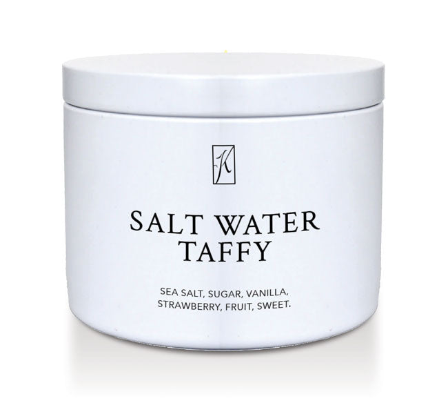 Kringle Candle Salt water taffy candle tin with a white lid on a white background