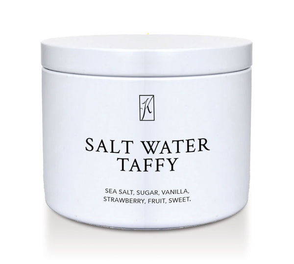 Kringle Candle Salt water taffy candle tin with a white lid on a white background