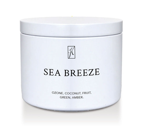 White candle tin container labeled 'Sea Breeze' with a Kringle Candle logo on a white background