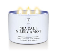White candle tin labeled 'Sea Salt & Bergamot' on a white background by Kringle Candle