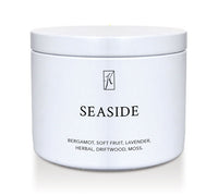 White tin candle container labeled 'Seaside' with a brand logo on a white background