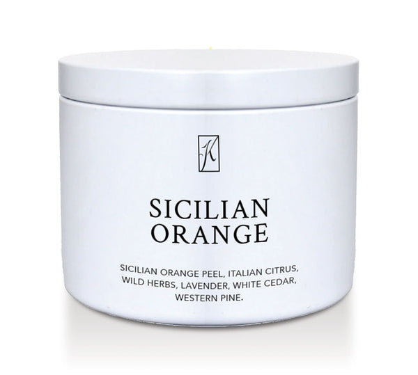 White tin candle container with 'Sicilian Orange' fragrance description on a white background