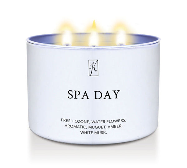 Candle in a white container labeled 'SPA DAY' with a logo on a white background