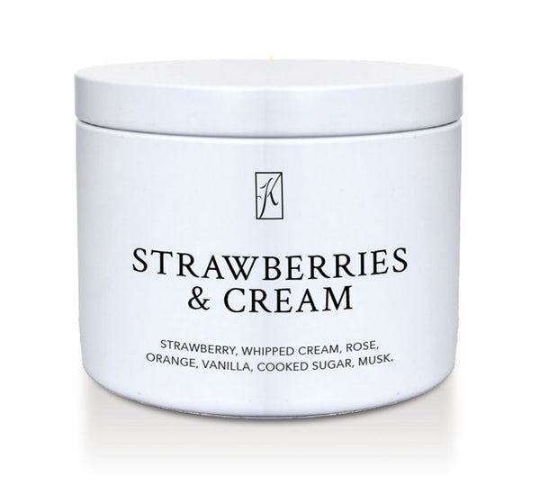 'Strawberries & Cream' scented candle in a white tin container on a white background.