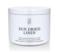 'Sun Dried Linen' fragrance candle in a white tin container on a white background