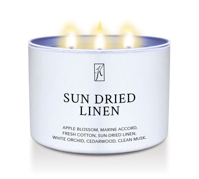 White Candle tin labeled 'Sun Dried Linen' with a Kringle Candle logo on a white background