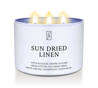 White Candle tin labeled 'Sun Dried Linen' with a Kringle Candle logo on a white background