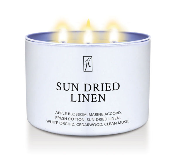 White Candle tin labeled 'Sun Dried Linen' with a Kringle Candle logo on a white background