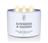 Candle in a white tin container labeled 'Sunshine & Daisies' with flames on a white background