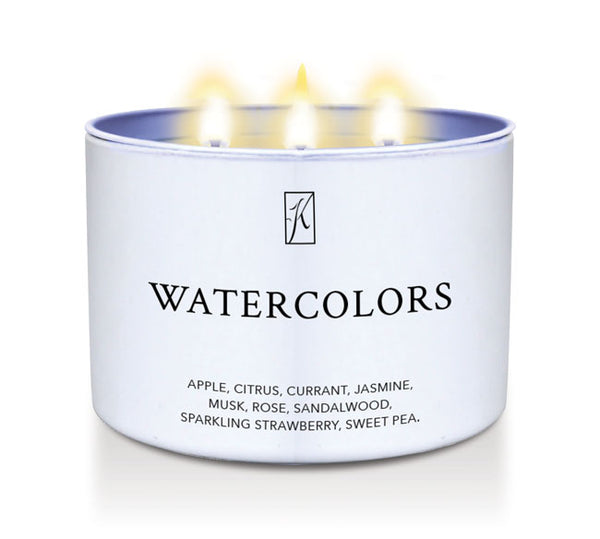 Candle in a white container labeled 'Watercolors' with flames on a white background