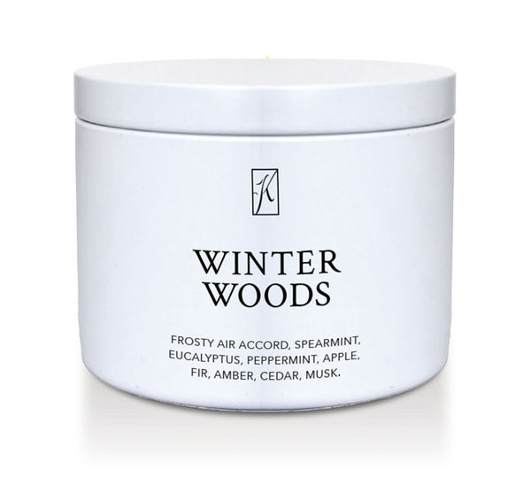 Jar of 'Winter Woods' candle with brand logo on a white background