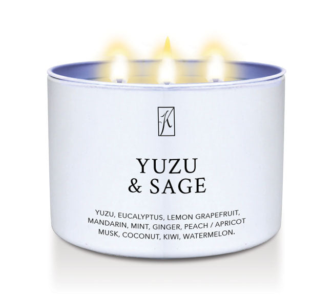 Candle in a white tin container labeled 'Yuzu & Sage' with a  Kringle Candle logo on a white background