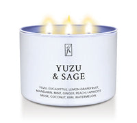Candle in a white tin container labeled 'Yuzu & Sage' with a  Kringle Candle logo on a white background