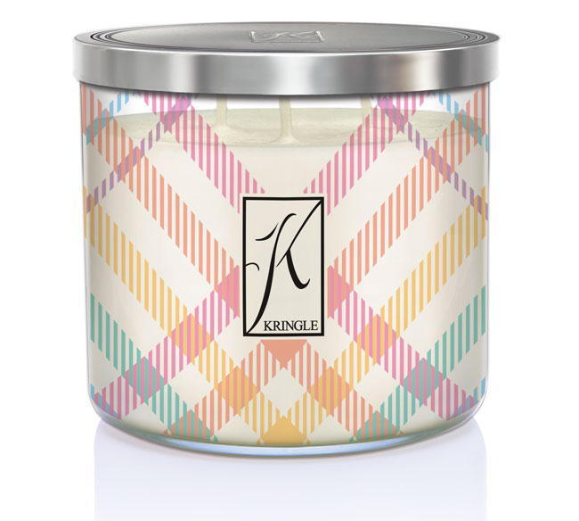 Three-wick candle in a silver tin, featuring a multicolored plaid design and a "K" logo with the word "Kringle" beneath it.