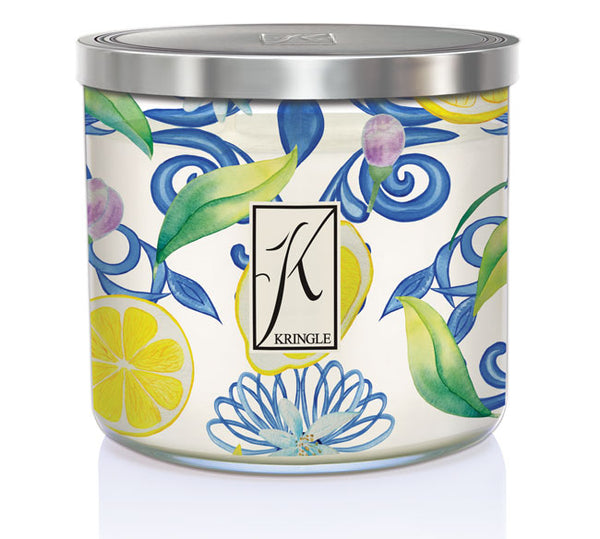 Kringle Candle Aegean Zest Large 3-Wick Candle – A wide glass jar candle with a metallic lid, featuring an elegant watercolor-inspired design of lemons, green leaves, and swirling blue floral patterns. The ‘Kringle’ logo is displayed in the center on a rectangular label. The candle contains white wax, housed in a decorative jar that complements its fresh, citrus fragrance.