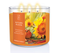 Kringle Candle Autumn Bloom candle with sunflower and pumpkin design on an orange label.