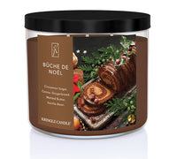 Kringle Candle Büche de Noèl candle with festive label on a white background