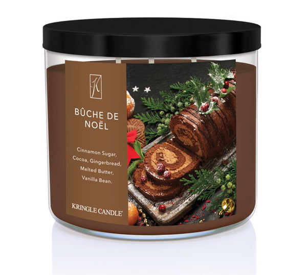 Kringle Candle Büche de Noèl candle with festive label on a white background
