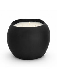 A matte black round candle pot with three white wicks and white wax, photographed on a clean white background.