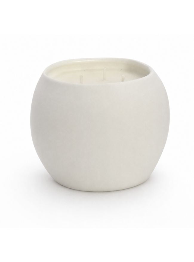 A minimalist, matte off-white ceramic candle holder or vessel with a rounded, egg-shaped form and an open top, shown on a seamless white background.