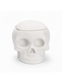 A white skull-shaped container with a matching lid, photographed against a clean white background.