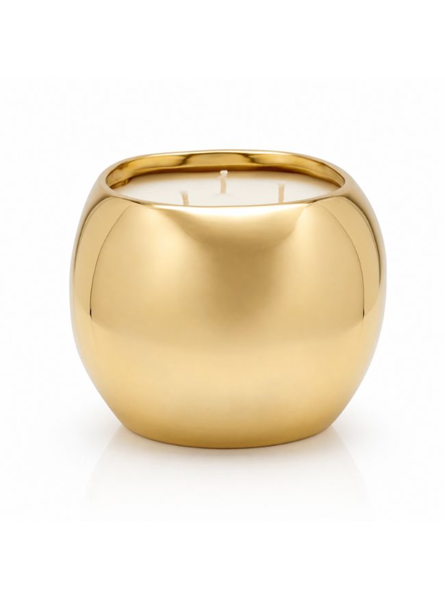 A modern, rounded metallic gold vessel candle with a smooth reflective finish, shown on a clean white background.