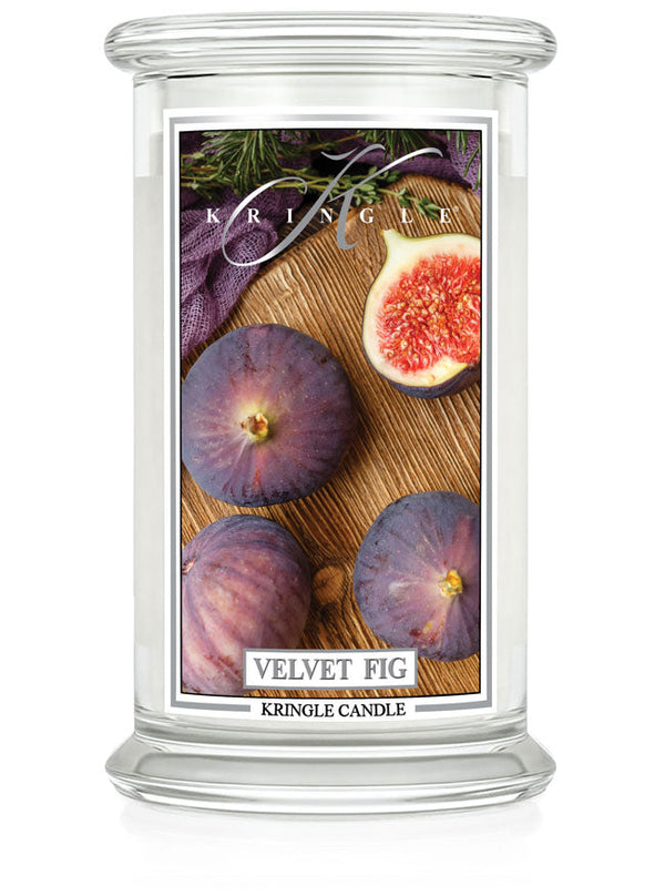 Velvet Fig Large 2-Wick Candle, unlit. Label shows whole and halved figs on wood with greenery.