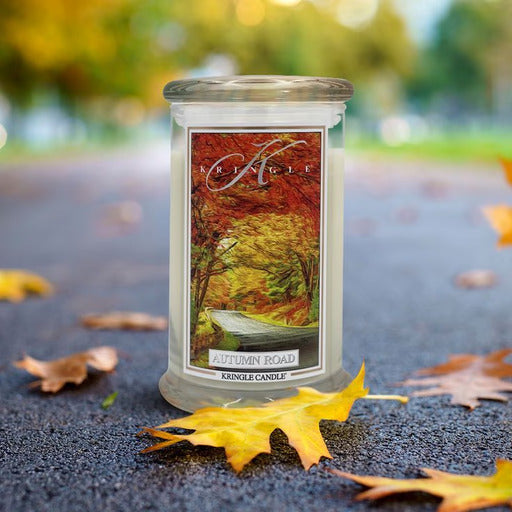 Kringle Candle Autumn Road on a road with autumn leaves