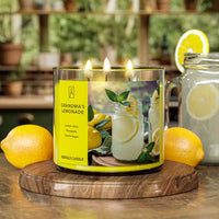 Lit candle labeled 'Grandma's Lemonade' with lemons and a glass of lemonade on a wooden coaster.