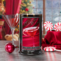 Kringle Candle in a decorative container with Christmas-themed elements on a table.