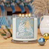 Kringle Candle with festive decorations on a wooden surface with 4-wick Sandalwood & Cade candle