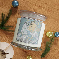 Sandalwood & Cade 4-wick scented candle jar on a wooden surface with Christmas decorations