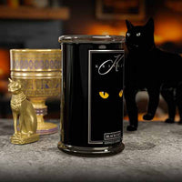 Black candle with 'Kringle Candle' branding and a black cat in the background