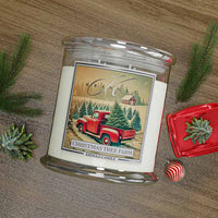 Kringle Candle Christmas Tree Farm candle with decorative elements on a wooden surface